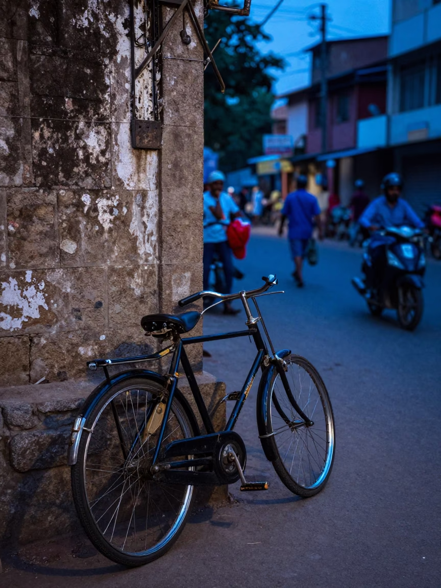 Evening Street Scene in Hyderabad India with Vintage Bicycle and Local Shopkeeper in in Hyderabad, India