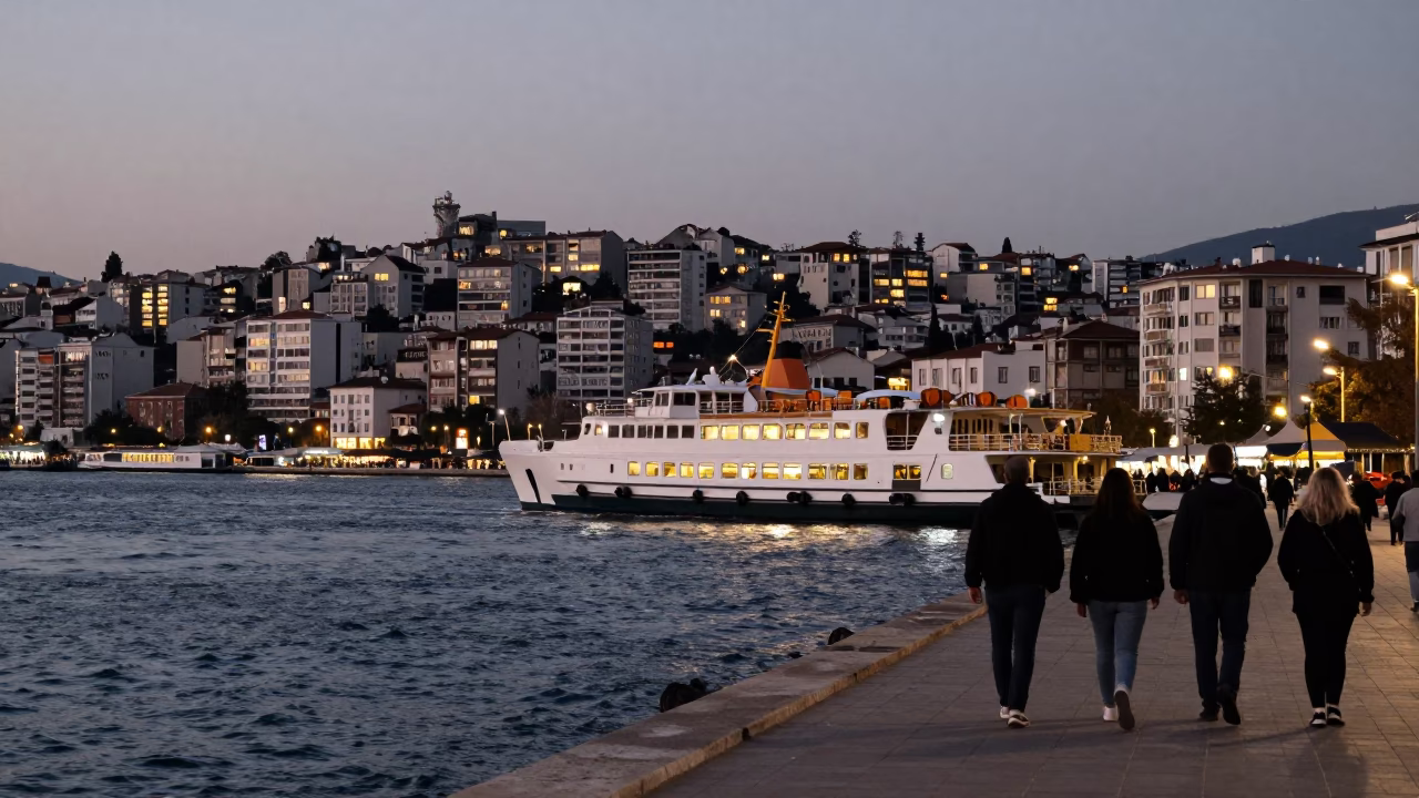 Evening Street Scene in Izmir Turkey with Catamaran Ferry and City Lights in in Izmir, Turkey