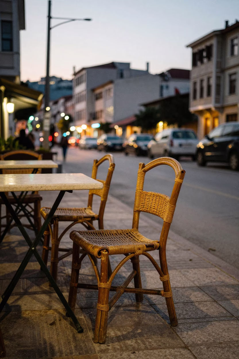 Evening street scene in Izmir Turkey with rattan chair and city lights in in Izmir, Turkey