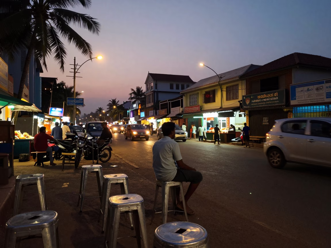 Evening Street Scene in Kochi India with Metal Stools and Local Diners in in Kochi, India