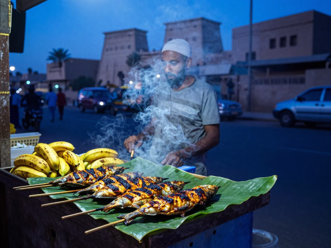 Evening Street Scene in Luxor Egypt with Grilled Fish and Banana Leaf in in Luxor, Egypt