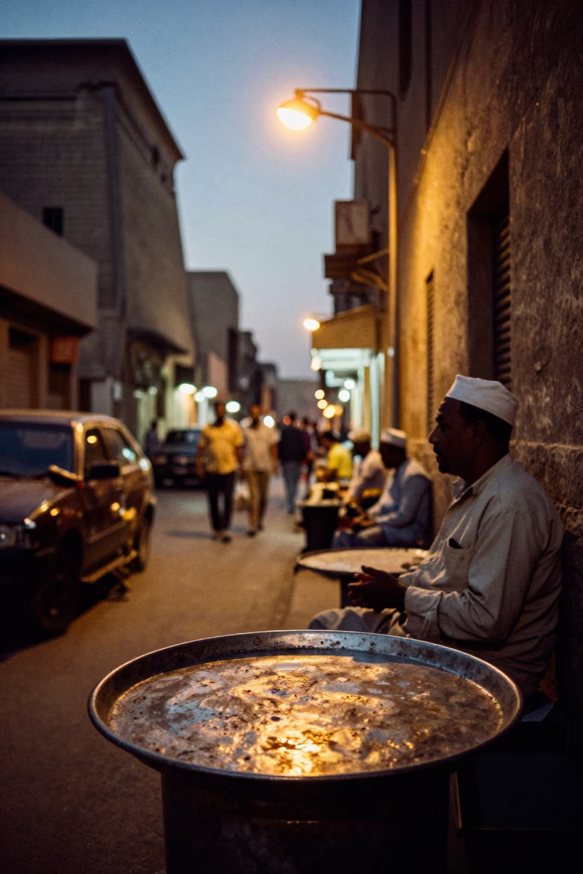 Evening Street Scene in Luxor With Dented Metal Rim And Blue Porcelain in in Luxor, Egypt