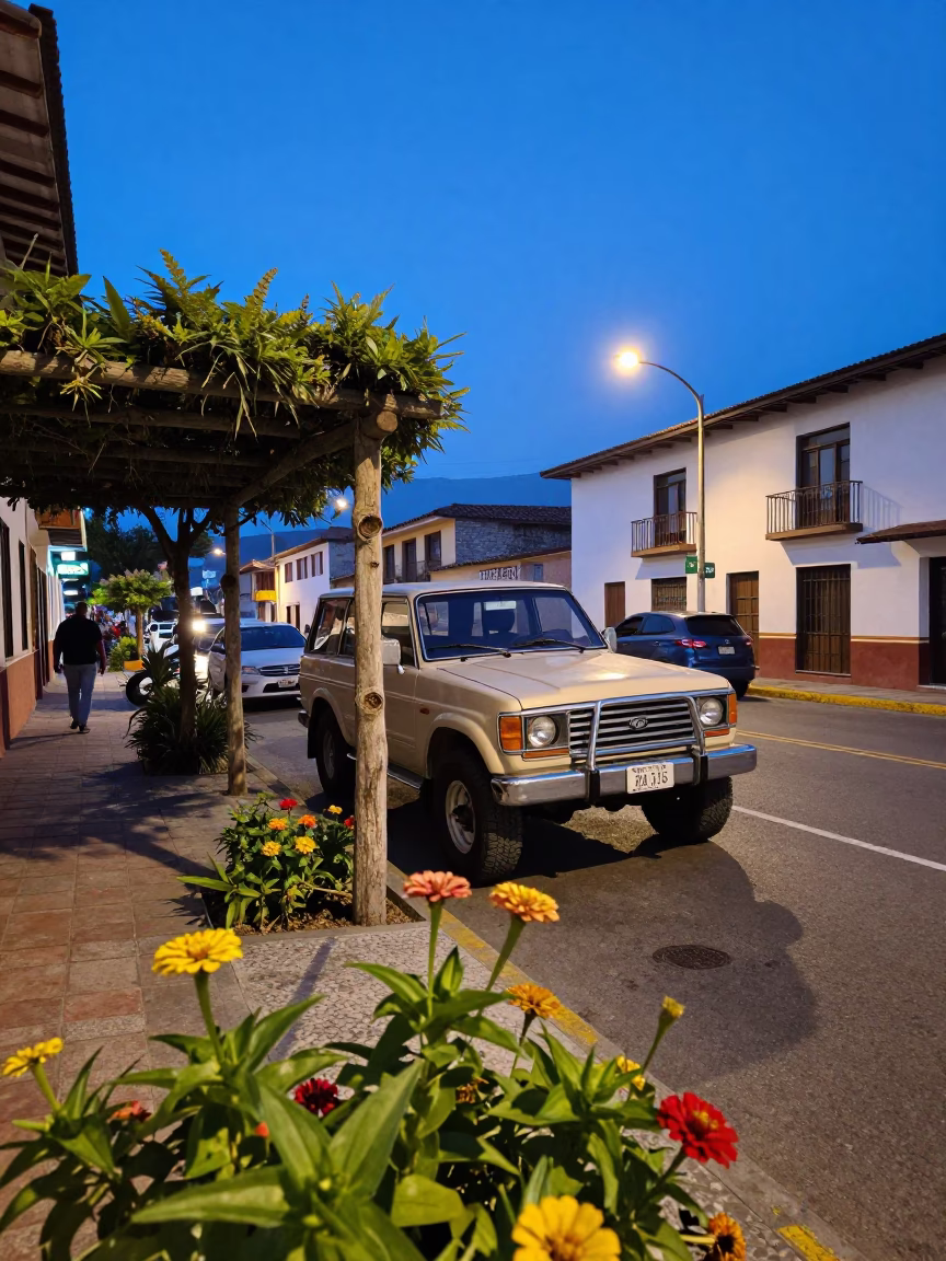 Evening Street Scene in Medellin Colombia with Vintage SUV and Zinnias in in Medellin, Colombia