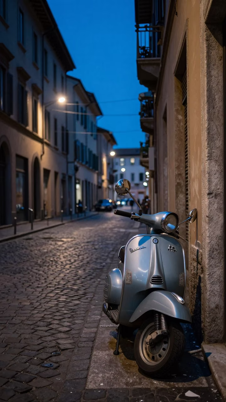 Evening Street Scene in Milan Italy with Cobblestones and Vintage Scooter in in Milan, Italy