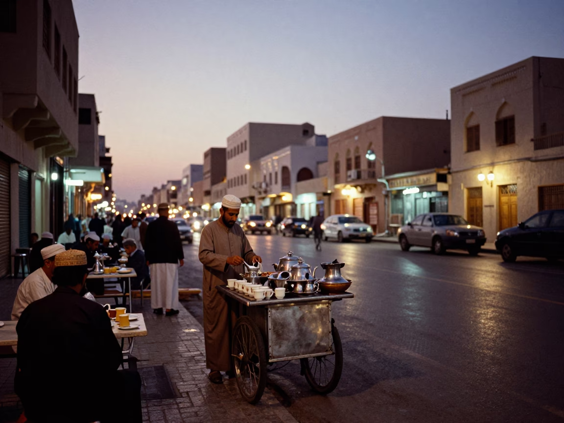 Evening Street Scene in Muscat Oman with Traditional Tea Service and City Lights in in Muscat, Oman