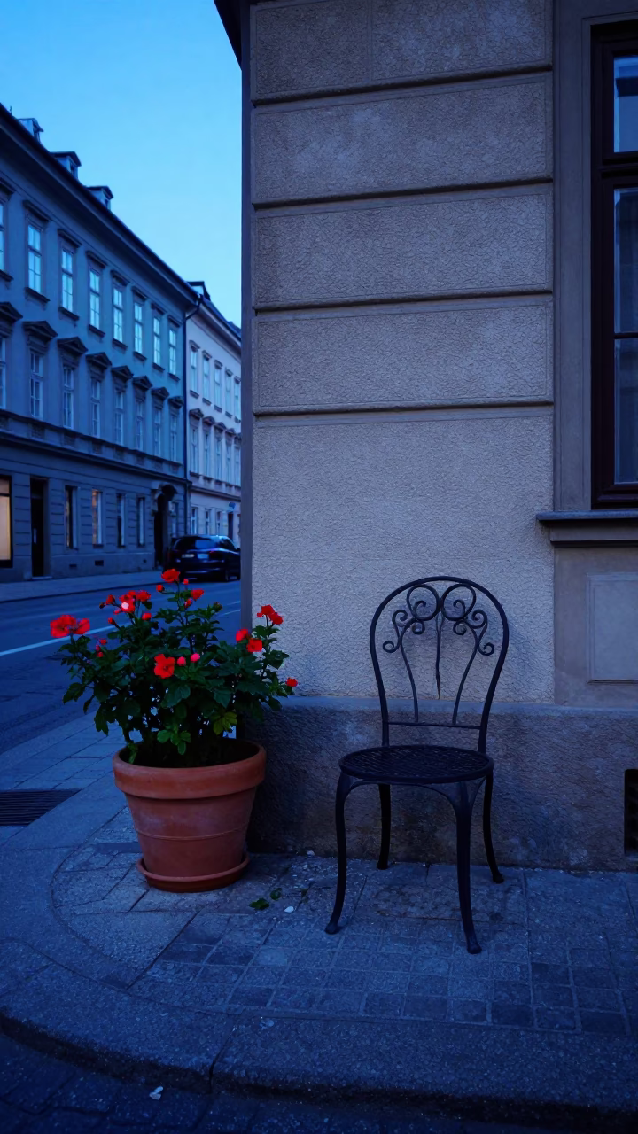 Evening Street Scene in Vienna Austria with Flowerpot and Chair in in Vienna, Austria