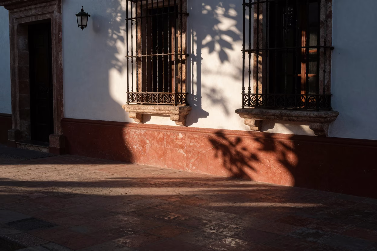 Evening Sunlight and Leaf Shadows on a Traditional Merida Mexico Balcony in in Merida, Mexico
