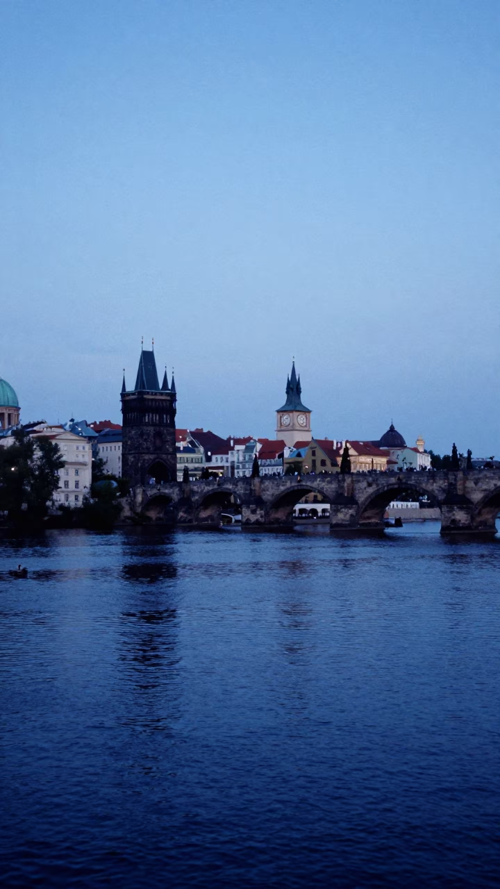 Evening View of Prague Vltava River and Charles Bridge Under Blue Hour Sky in in Prague, Czech Republic
