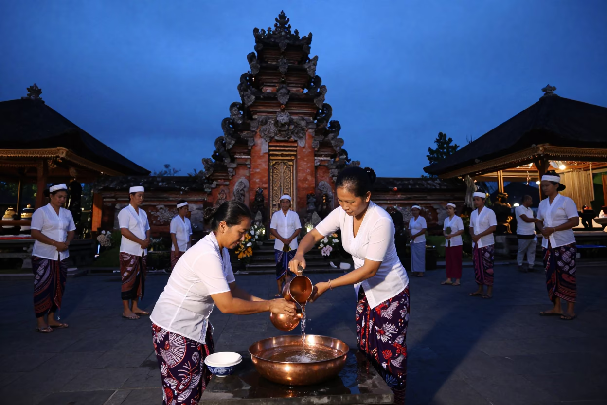 Evening Water Blessing Ceremony in Denpasar Bali Temple Courtyard with Traditional Offerings in in Denpasar, Indonesia