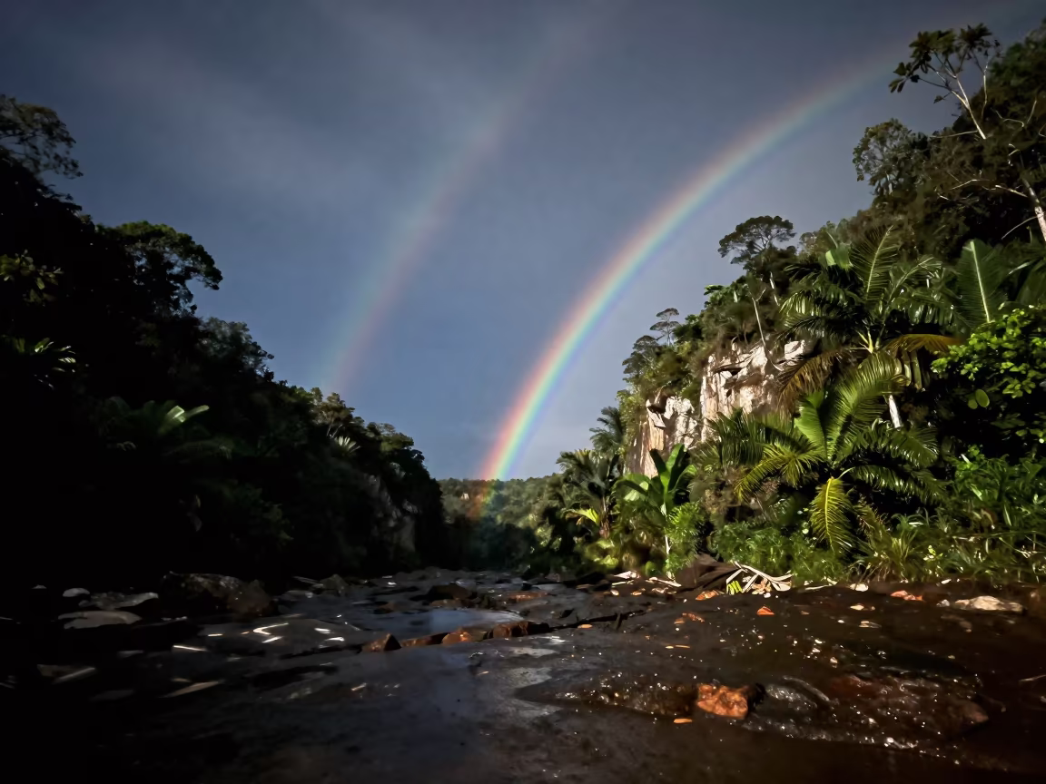 Faint Lunar Rainbow Over Brazilian Gorge Night in beneath thin cloud gaps and stars in Brazil