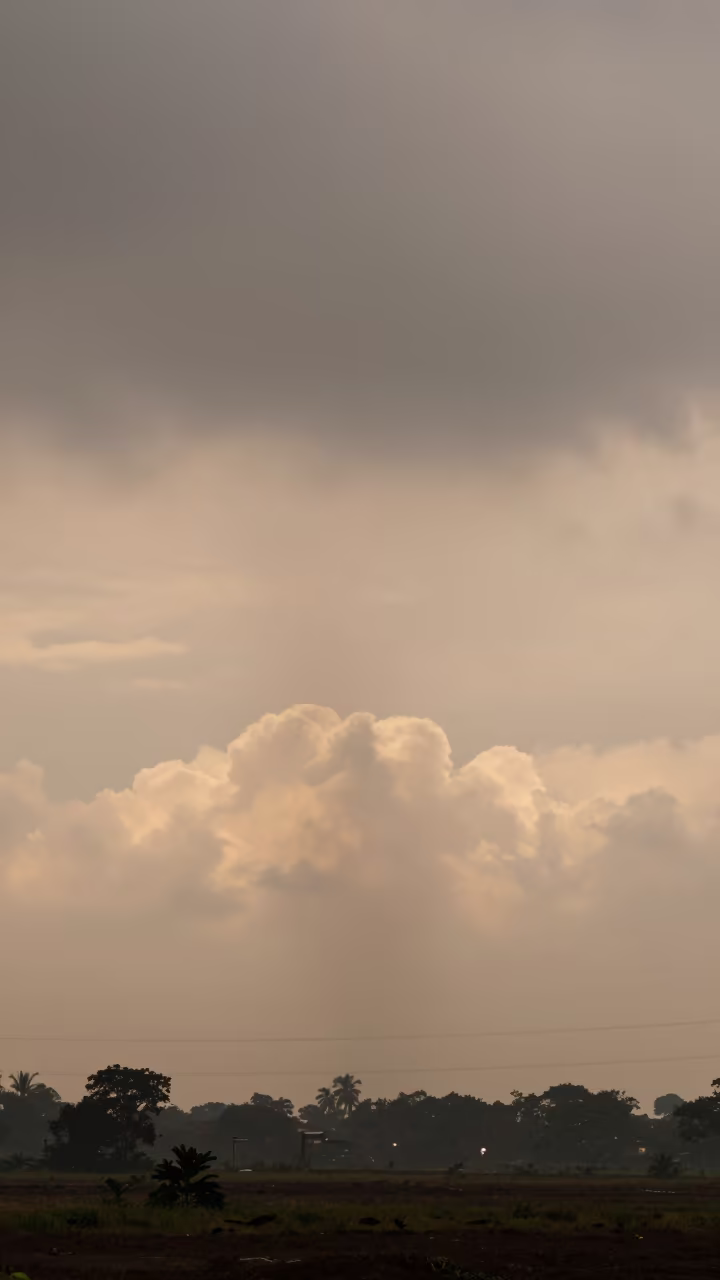 Fallstreak Hole Over Kolkata Monsoon Plain in across a storm-bright plain near Esplanade, Kolkata