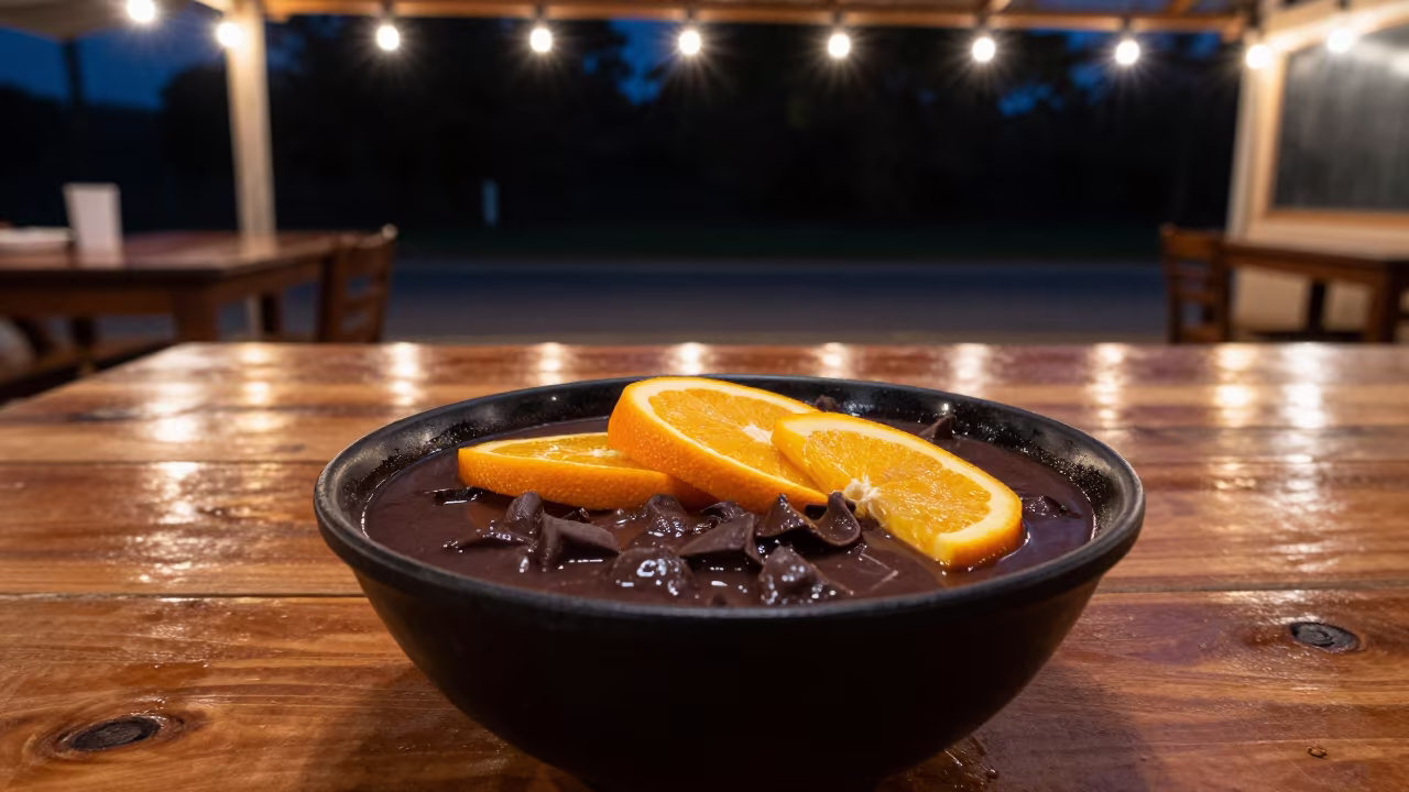 Feijoada Bowl with Orange Slices on Diner Table in at a roadside diner table in Thane