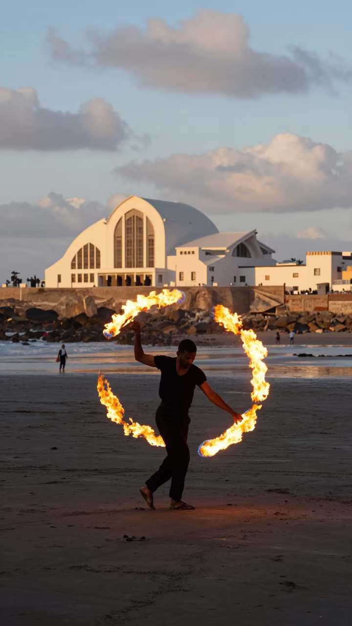 Fire Dancer on Dark Beach at Late Afternoon in in a concert hall in Essaouira