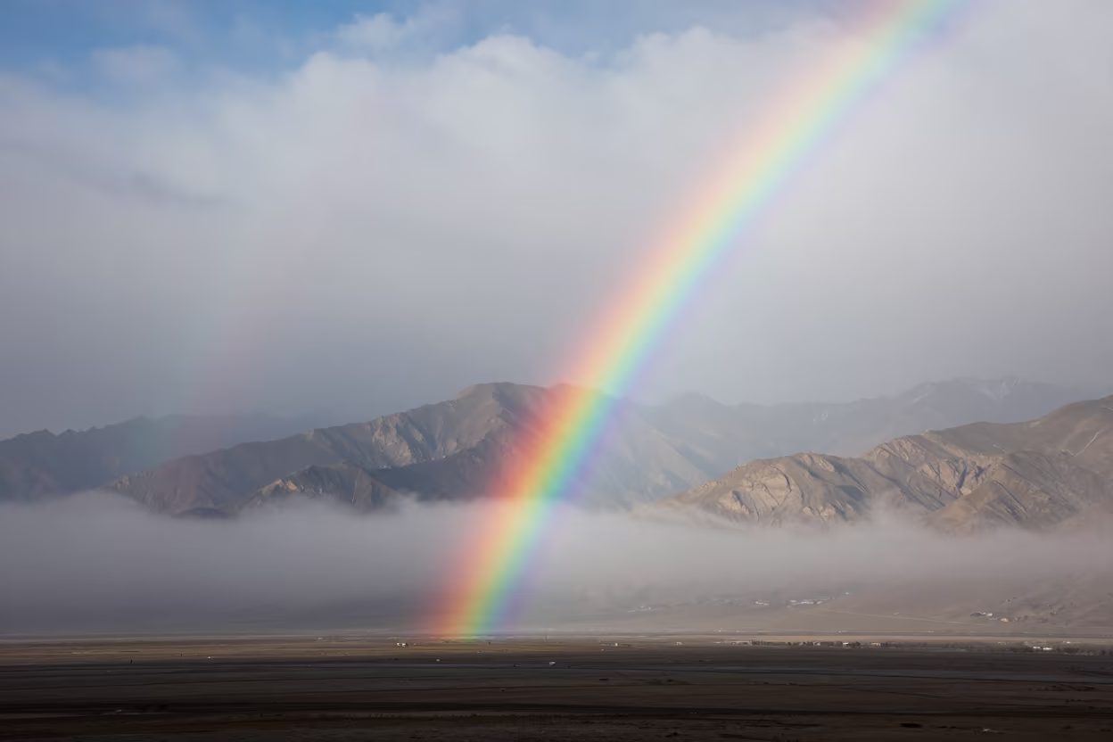 Fire Rainbow Cirrus Clouds Over Kashmir Storm in across a storm-bright plain in Kashmir