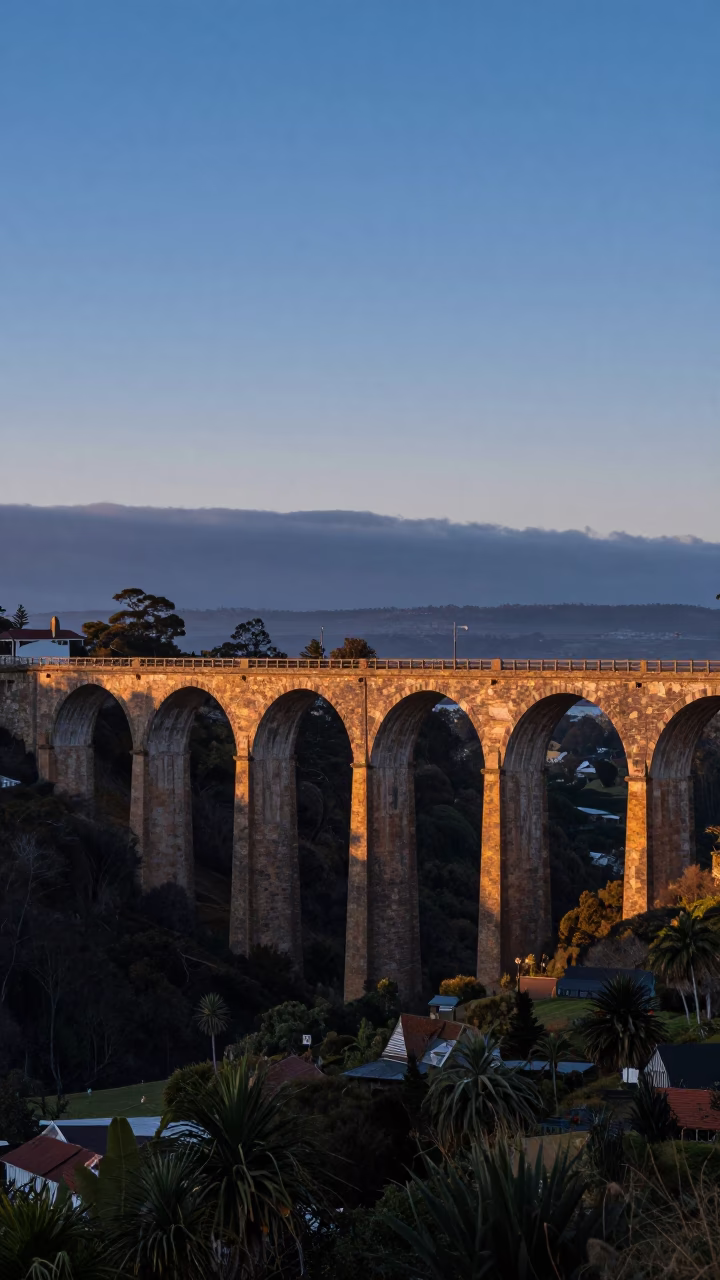 First Light Dawn over Hobart Tasmania Railway Viaduct and Derwent River Waterfront in in Hobart, Tasmania, Australia