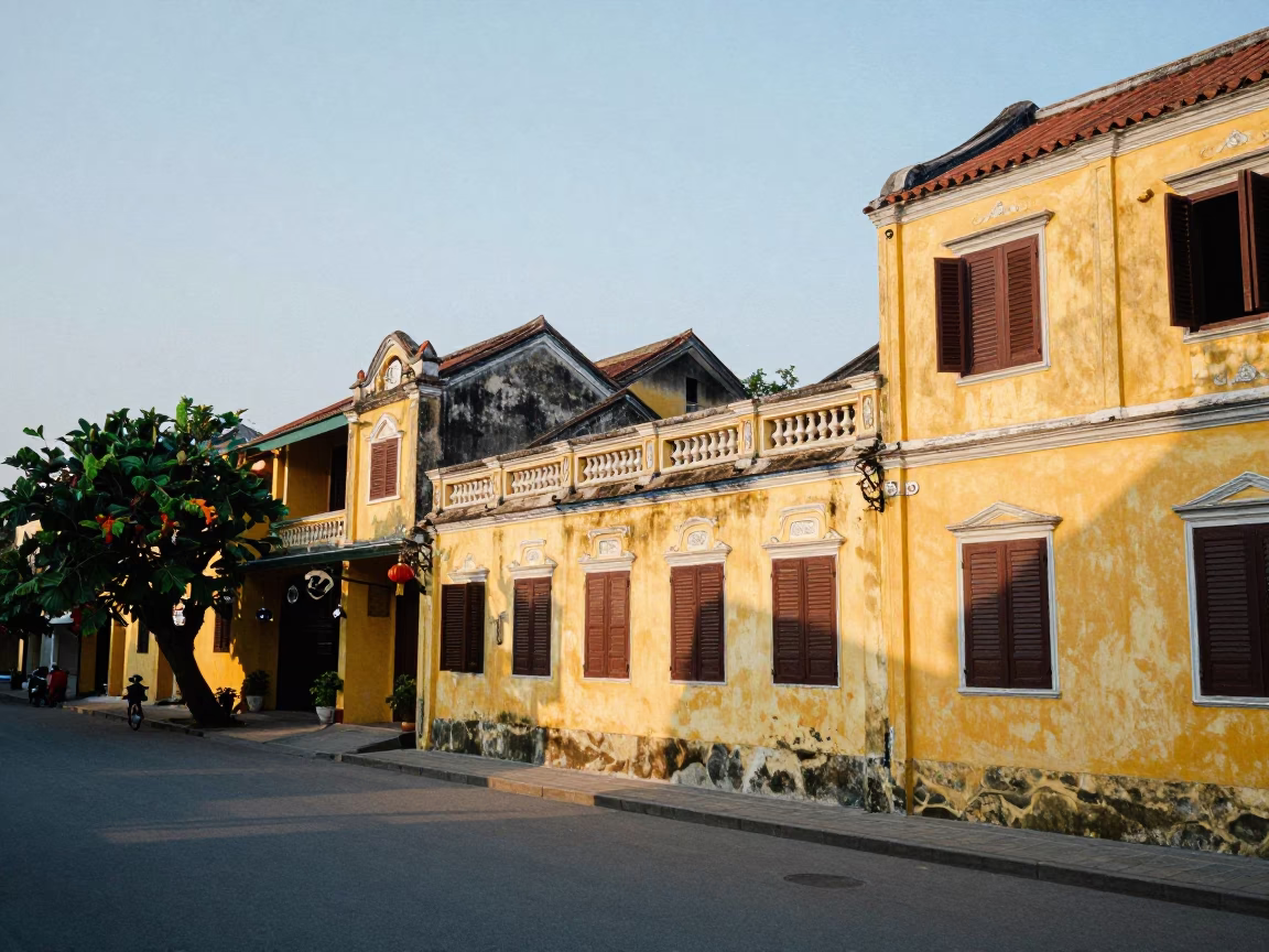 First light illuminating Hoi An ancient town yellow walls and lanterns in in Hoi An, Vietnam