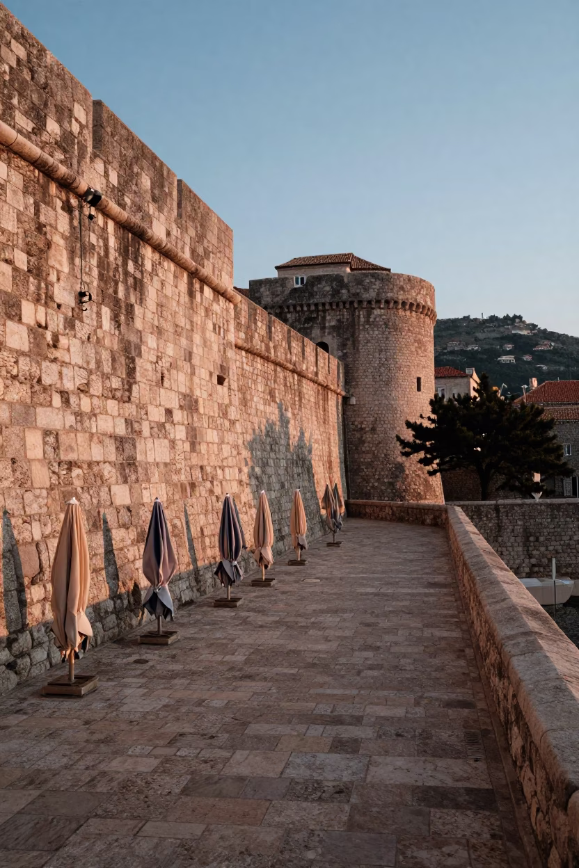 First Light Morning in Dubrovnik Croatia Stone Walls and Umbrellas in in Dubrovnik, Croatia