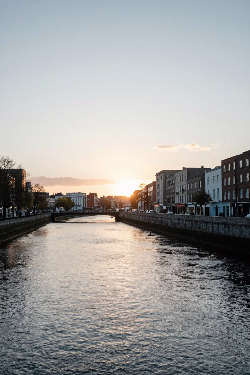 First light on Dublin’s River Liffey with historic stone quays and morning commuters in in Dublin, Ireland