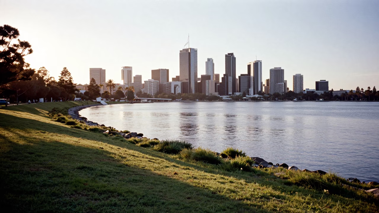 First light on Perth Swan River foreshore with city skyline and river tram reflections in in Perth, Western Australia, Australia