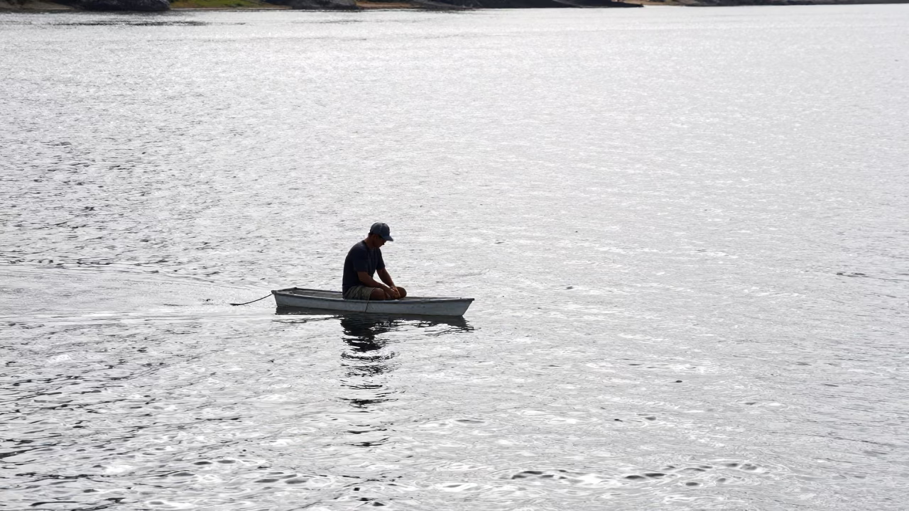 Fisherman at Flat Noon Light in in Perth, Western Australia, Australia