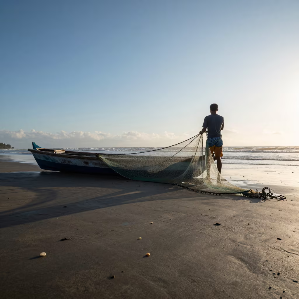 Fisherman Hauls Net from Dory at Dawn in along a beach near Mandalay