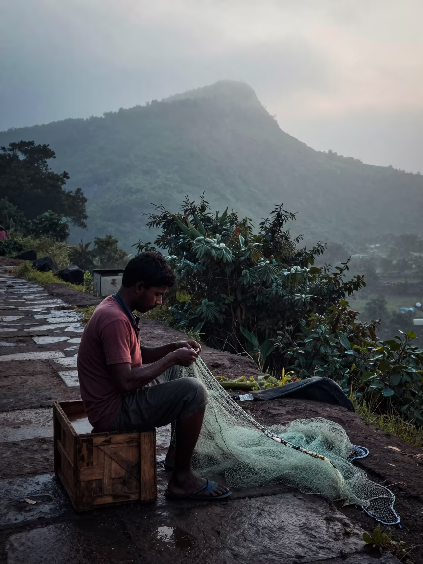 Fisherman Mending Nets on Mountain Path at Dawn in on a mountain path near Mumbai