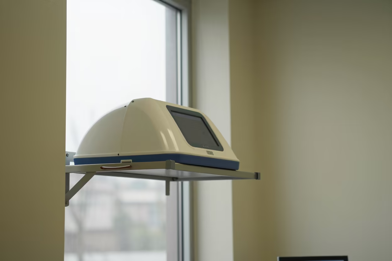 Fit Test Hood on Shelf at Nurse Station in at a nurse station under monitor glow near Tikrit