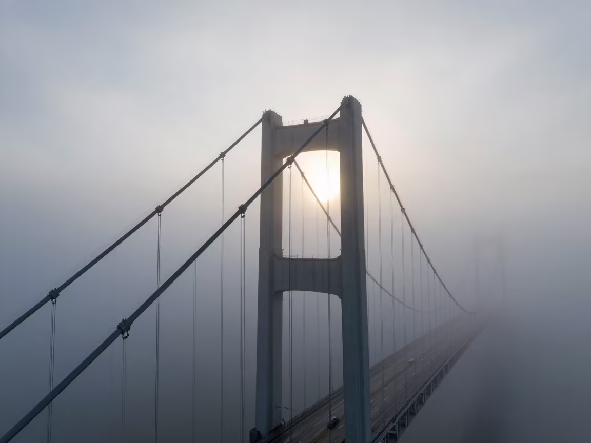 Fog Rolls Through Bridge Towers Morning Light in through low marine fog near Higüey