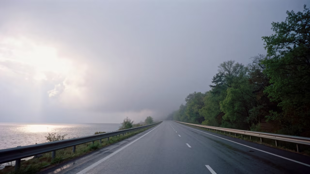 Fog Swallows Coastal Highway in Late Afternoon Slovakia in beneath fast-moving cloud bands in Slovakia