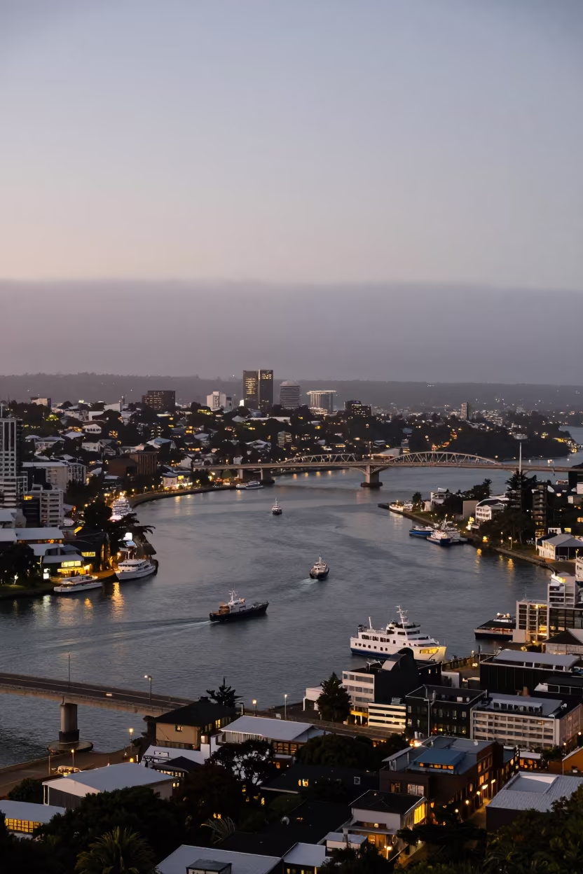 Fogbound Harbor Canal City at Dusk with Glowing Lights in beside a fogbound harbor mouth near Auckland