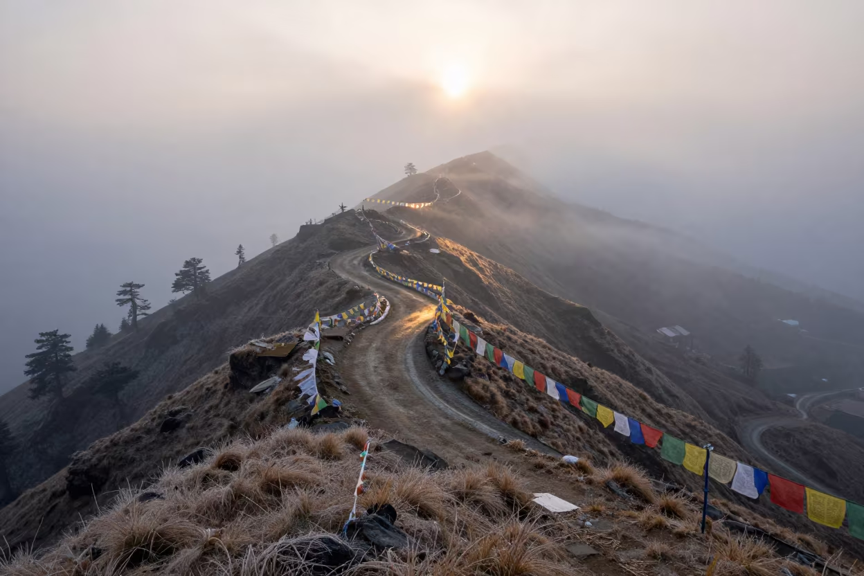 Foggy Mountain Pass at Dawn Near Shimla in on a wind-cut ridge below prayer flag lines near Shimla
