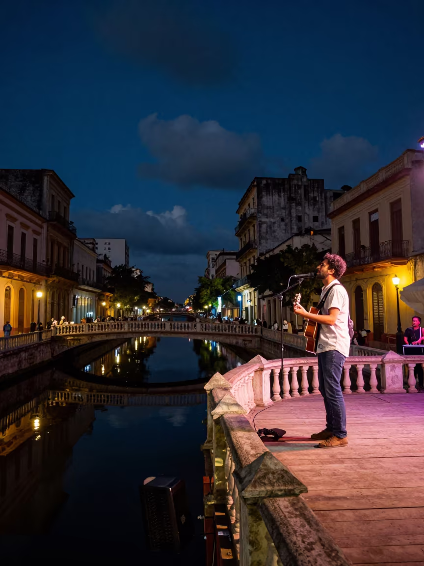 Folk Guitarist Sings Under Firelight Bridge in on a festival main stage in Havana