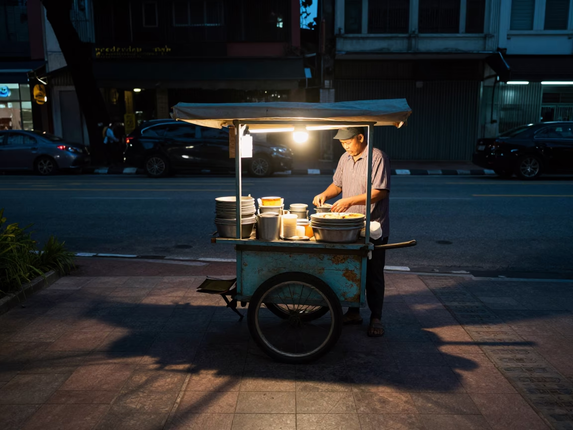 Food Vendor in Kuala Lumpur at The Predawn Darkness Light in in Kuala Lumpur, Malaysia