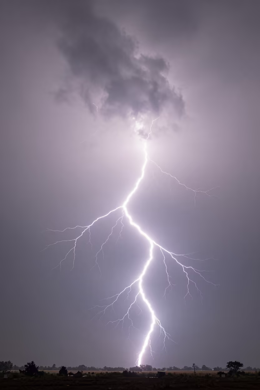 Fractal Lightning Over Winter Thunderheads in over a horizon of stacked thunderheads in Haryana