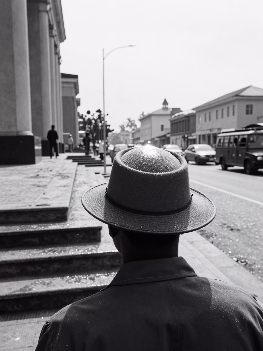 Freezing Rain Glaze on Crossing Guard Hat in on the steps of city hall near Kenema