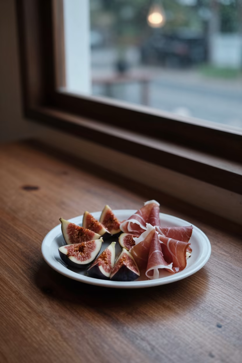 Fresh Figs and Prosciutto on Cafe Table in on a cafe table by a window near Krabi