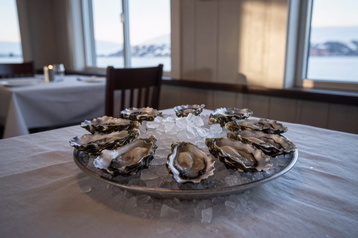 Fresh Oysters on Ice in Anchorage Dawn in on a linen-covered restaurant table in Anchorage