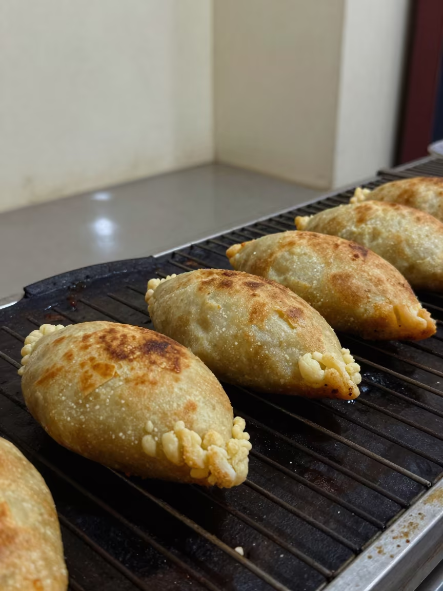 Fresh Pupusas on Comal in Gulshan Bakery in on a bakery cooling rack in Gulshan, Dhaka