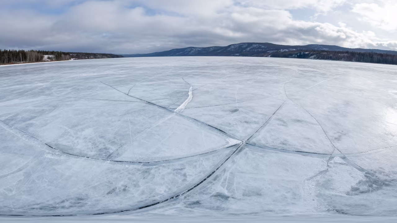 Frozen Lake Geometric Ice Cracks Bird's Eye View in in Canada