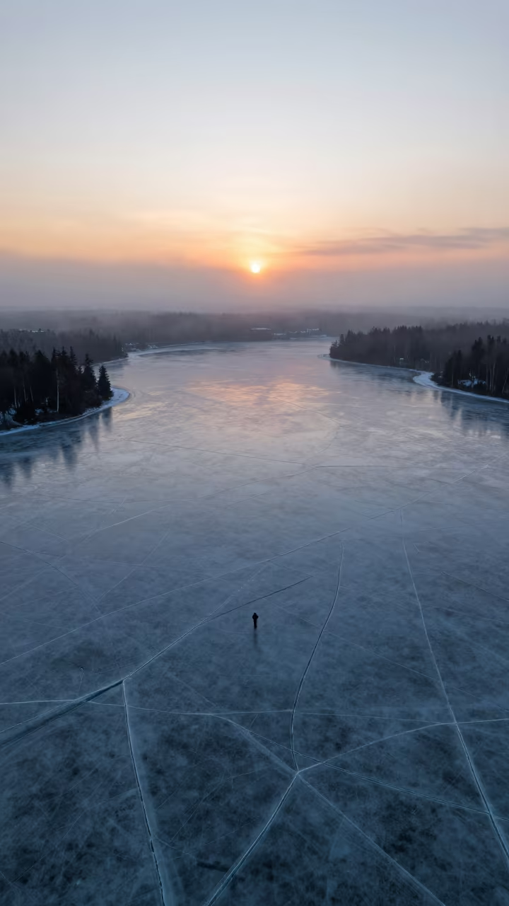 Frozen Lake Ice Cracks Sunset Ontario Mist in across a floodplain after rain in Ontario