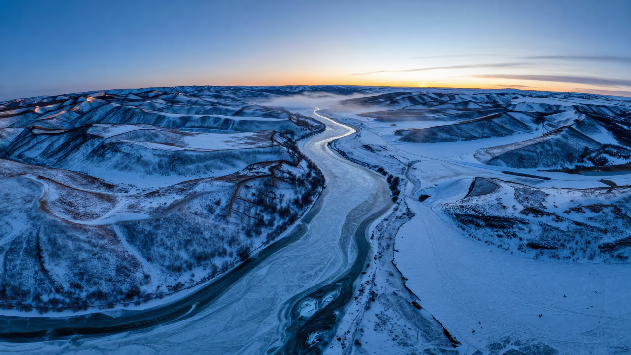 Frozen River Blue Hour Alberta Tundra in far above terraced hillsides in Alberta