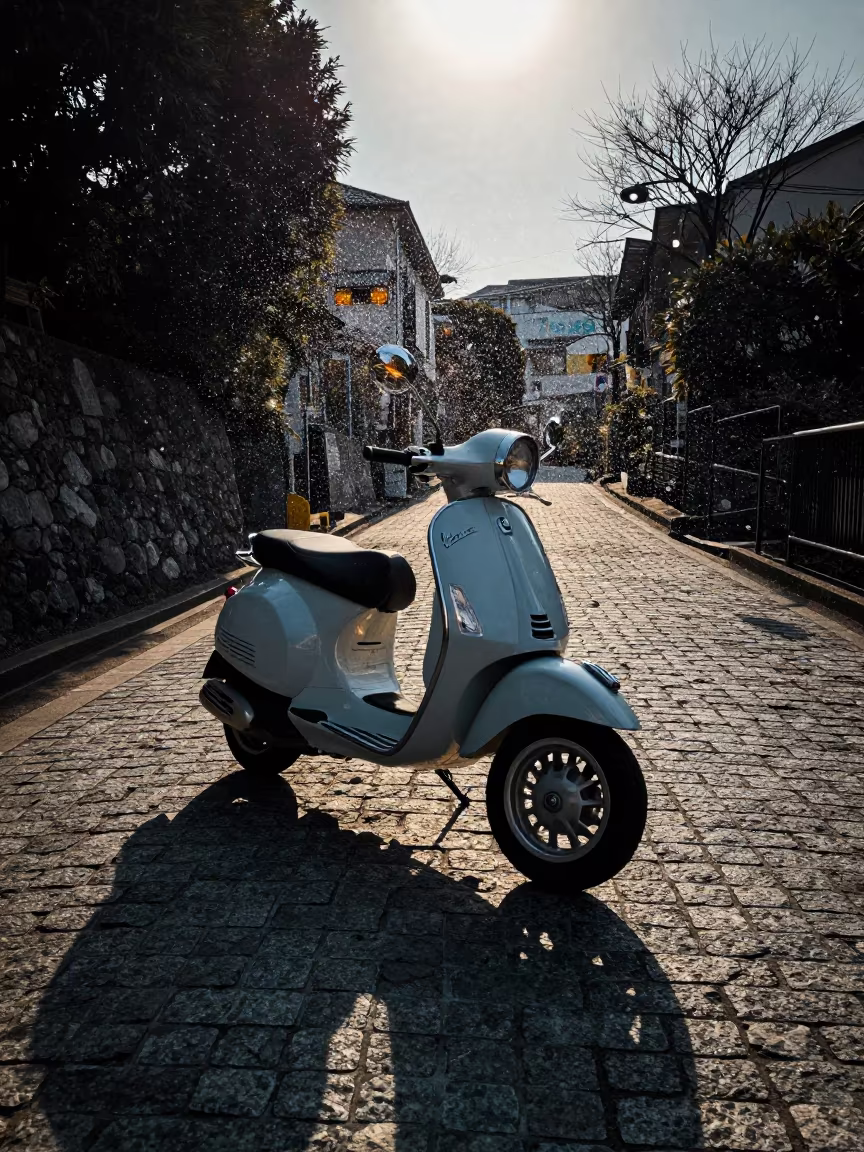 Frozen Sea Spray Around Vintage Vespa on Tokyo Cobblestones in along a switchback approach near Tokyo