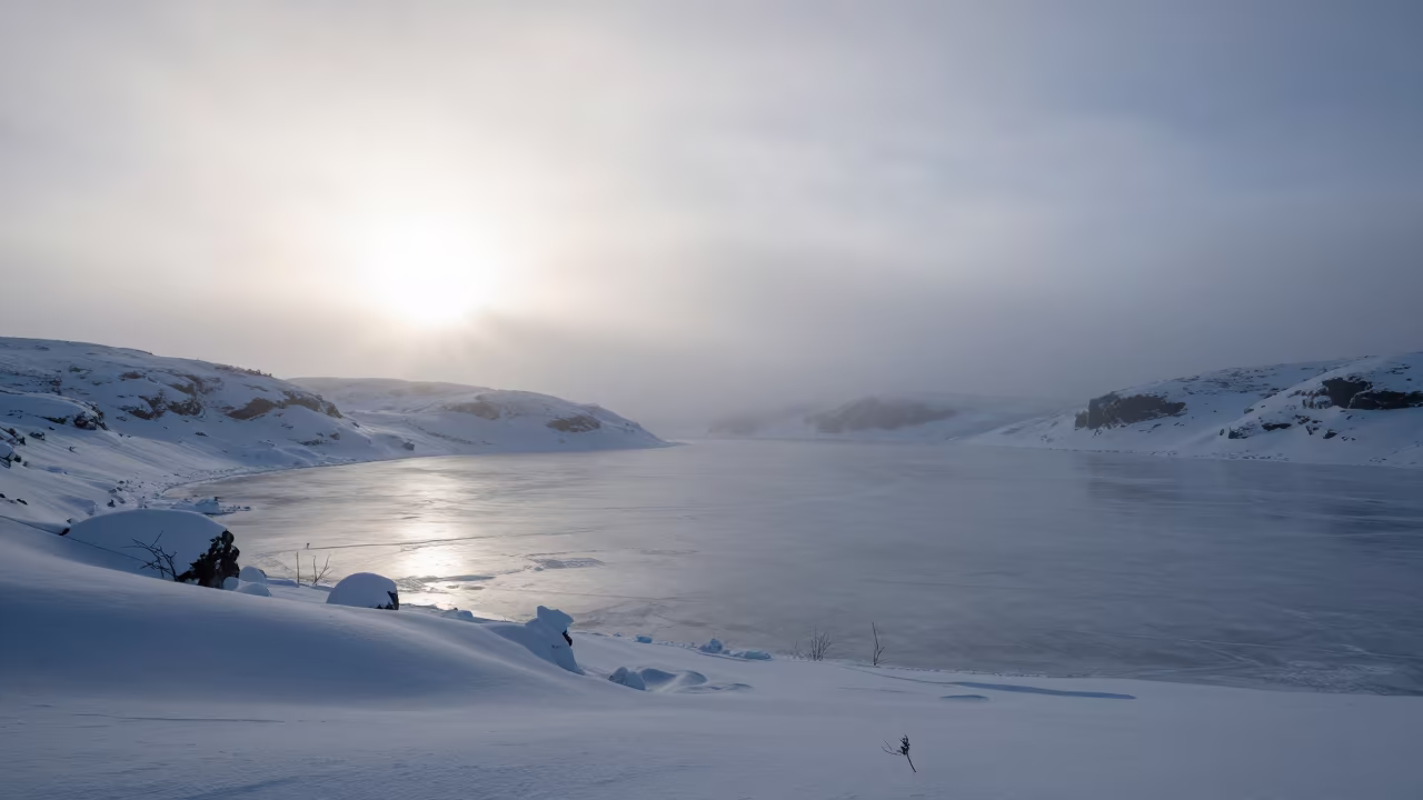 Frozen Tarn in Winter Mist Above Helsinki Foothills in from a ridge above layered foothills near Kallio, Helsinki