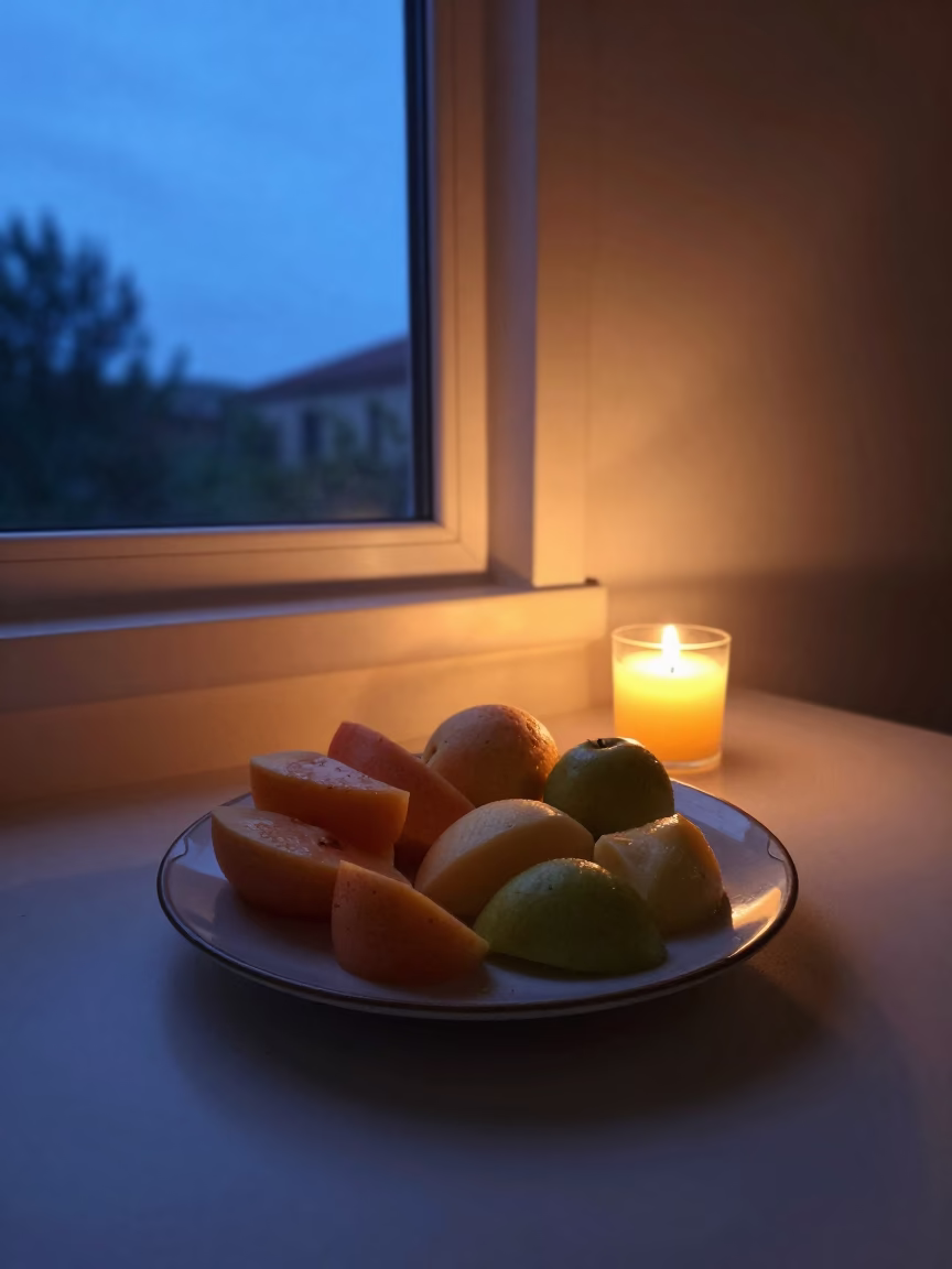 Fruit Plate Glowing in Muscat Twilight Window in on a ceramic plate by a window in Muscat