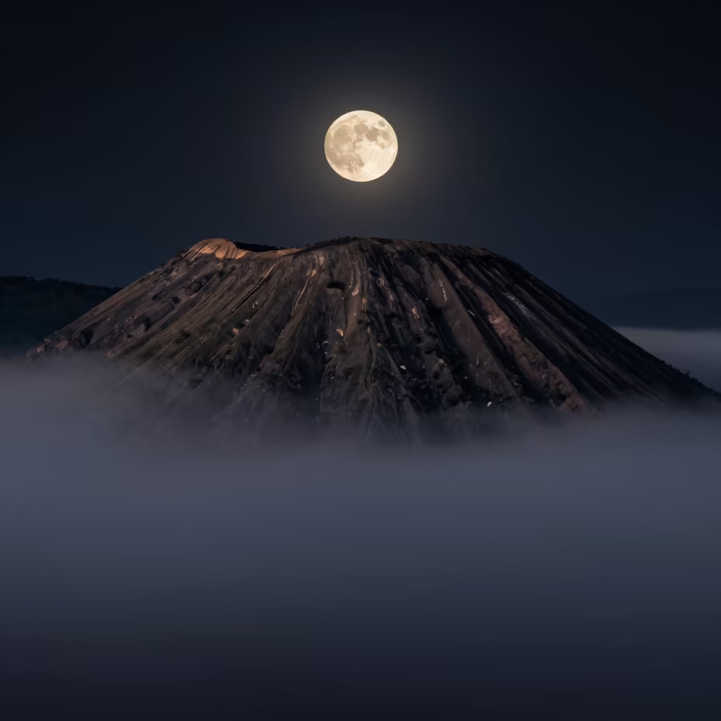 Full Moon Over Volcanic Cone in Misty Yunnan in in Yunnan