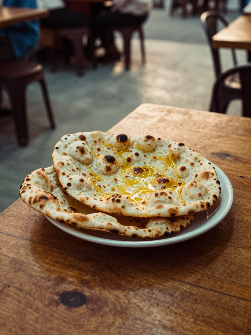 Garlic Butter Naan on Diner Table in Aba in at a roadside diner table in Aba