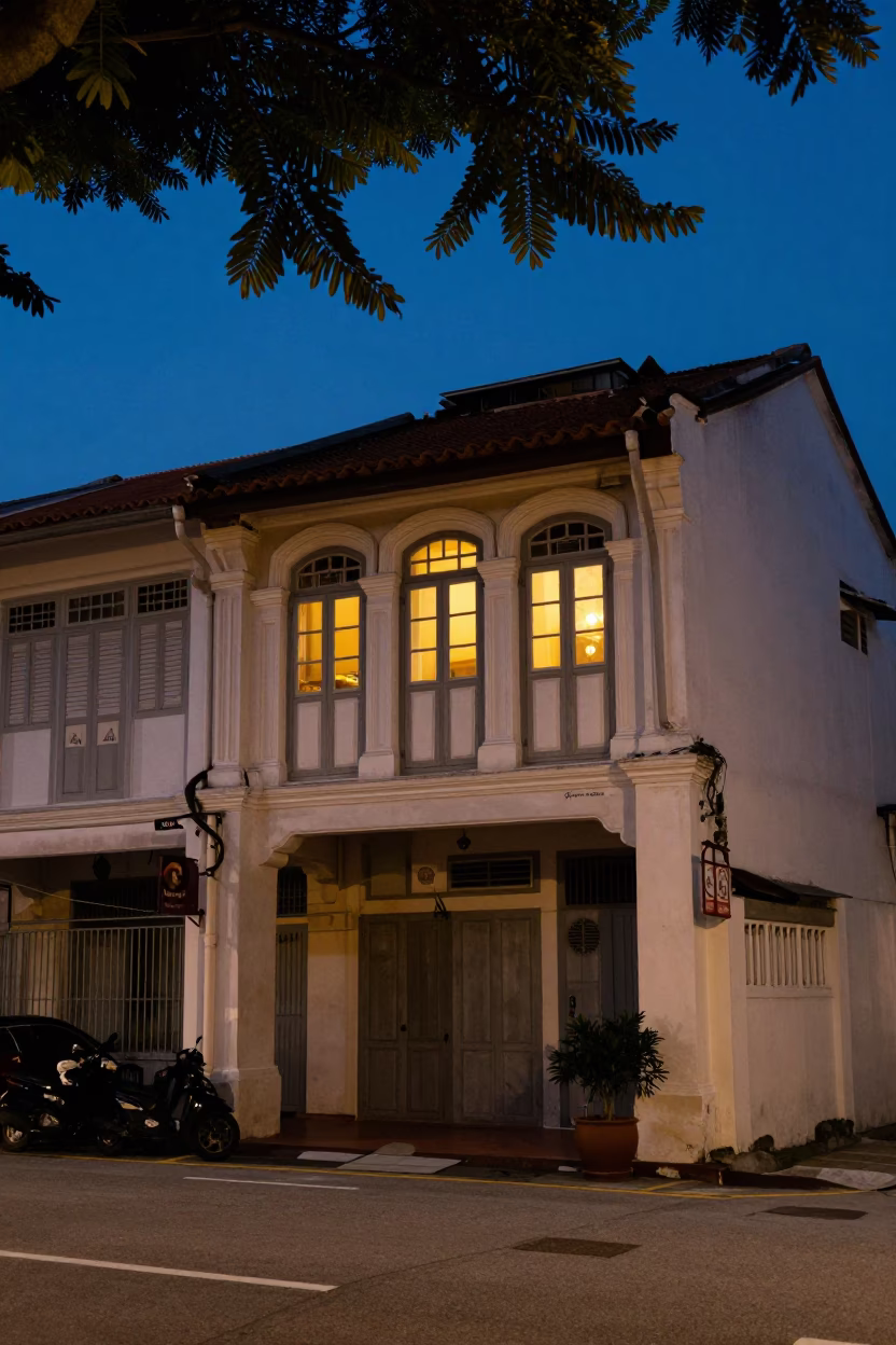 George Town Malaysia Blue Hour Street Scene with Leaf Shadows and Warm Window Light in in George Town, Malaysia