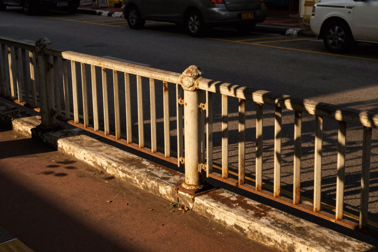 George Town Malaysia Golden Hour Street Scene with Leaf Shadows on Rail in in George Town, Malaysia