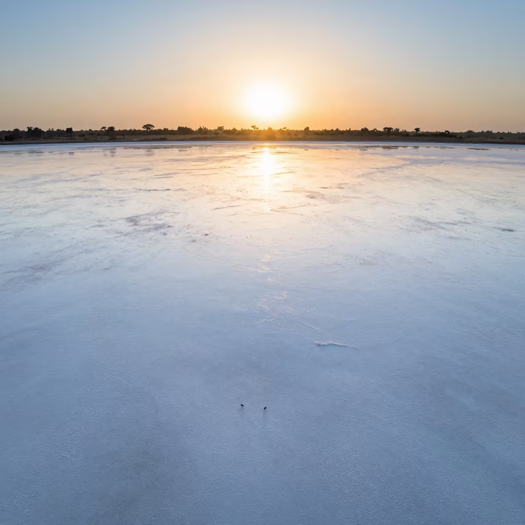 Ghanaian Salt Flat Mirror Horizon Rainy Season in across a wide valley floor in Ghana
