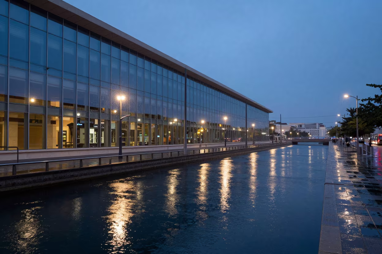 Glass Curtain Wall Tram Wires Canal Kuwait Twilight in beside a canal-front facade in Kuwait